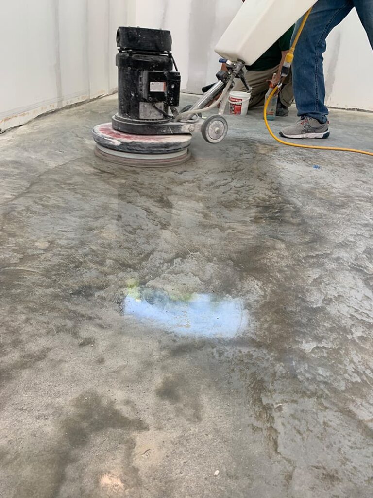 Man polishing shiny concrete floor